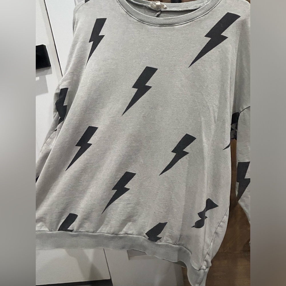 Oversized, long sleeve lightening bolt top by Easel